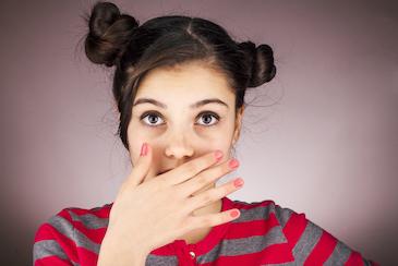 Dental veneers Seattle | woman covering smile