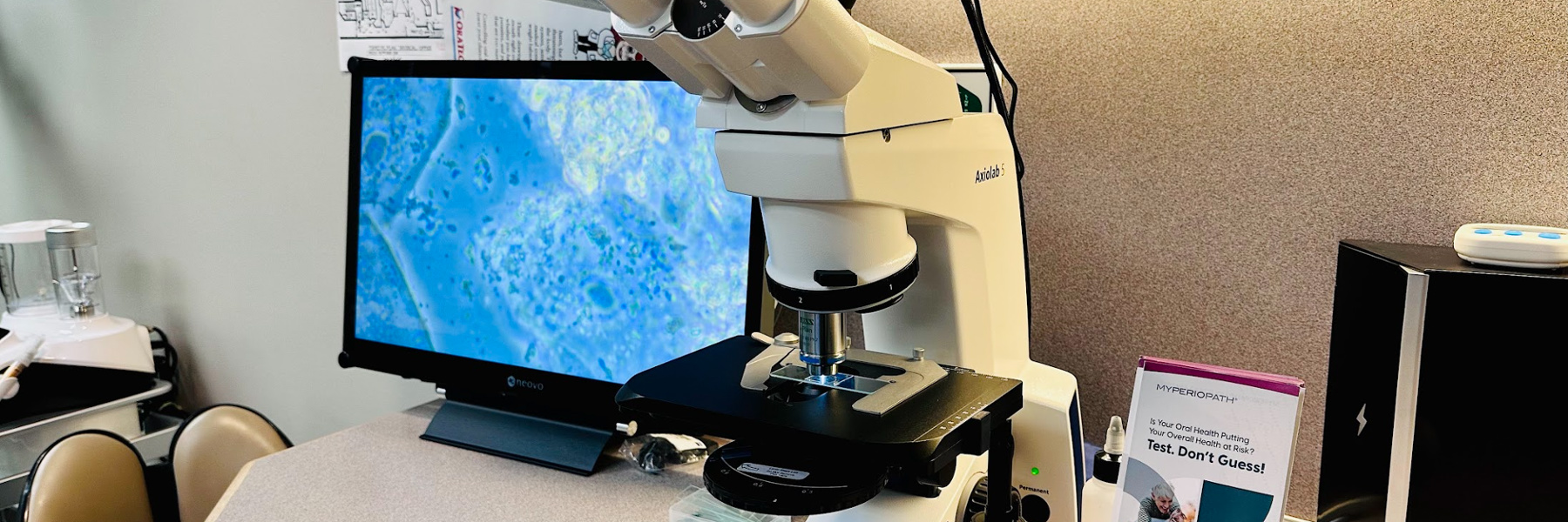 image of microscope and screen in office