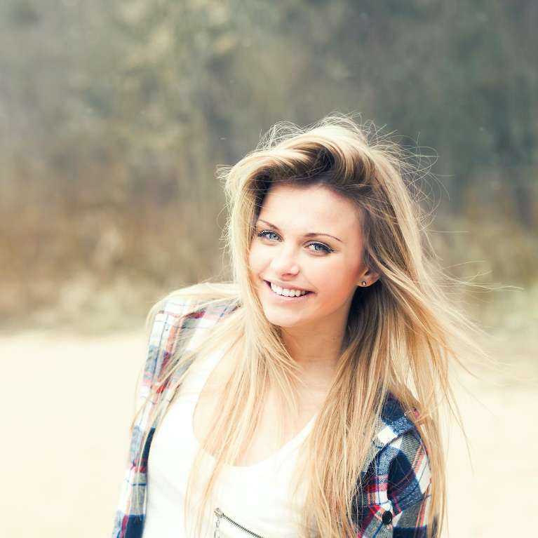 non toxic dentistry west seattle | woman smiling