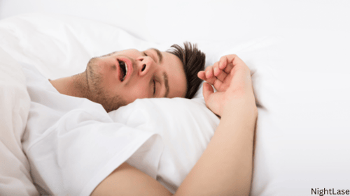 Man sleeping with mouth open likely snoring
