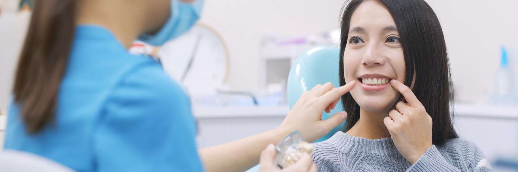 dental crown west seattle | woman at dentist