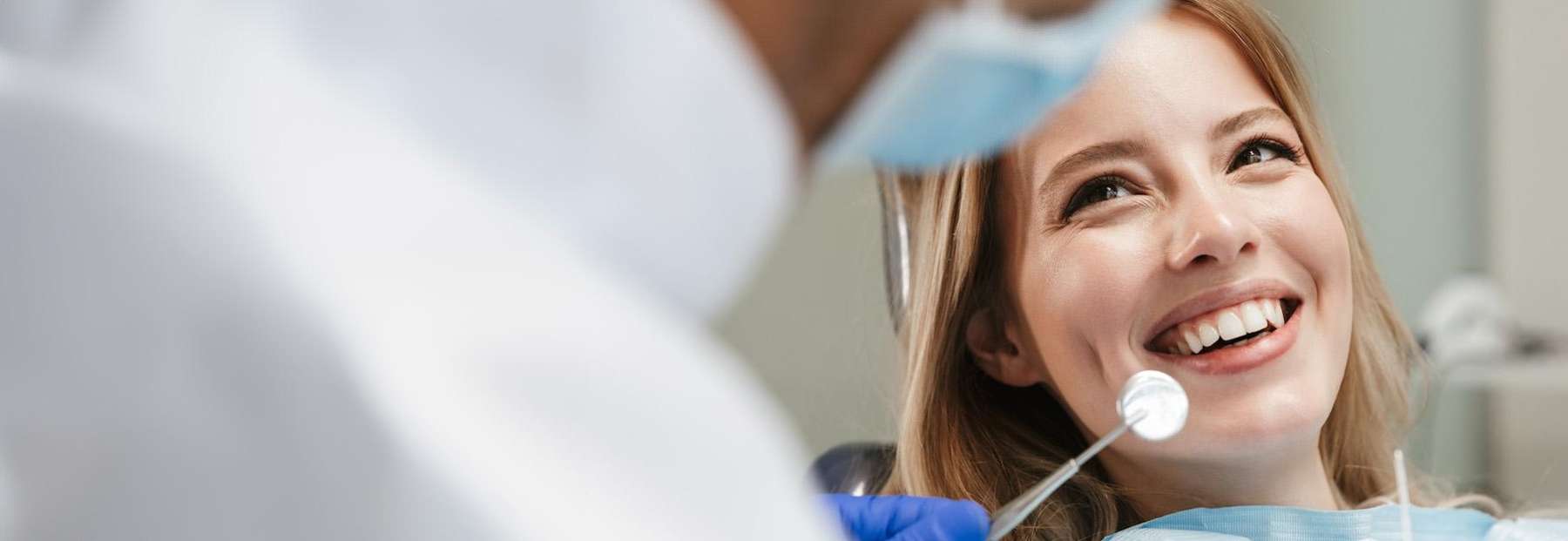 wellness dentist West Seattle, WA | woman at dentist